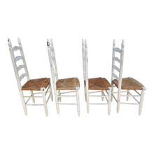 Load image into Gallery viewer, Vintage Farmhouse Chippy White Painted Rush Seat Ladderback Dining Chairs - Set Of 4