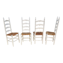Load image into Gallery viewer, vintage farmhouse chippy white painted rush seat ladderback dining chairs - set of 4 at EclecticCollective.com - Main Product Photo