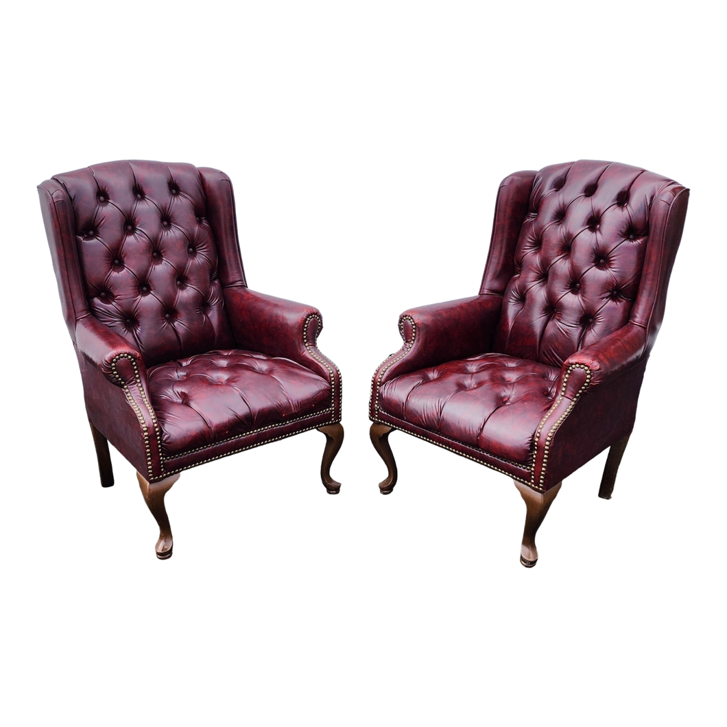 vintage oxblood faux leather tufted queen ann wingback chesterfield armchairs - a pair at EclecticCollective.com - Main Product Photo