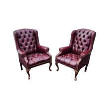 Load image into Gallery viewer, vintage oxblood faux leather tufted queen ann wingback chesterfield armchairs - a pair - at EclecticCollective.com - Thumbnail